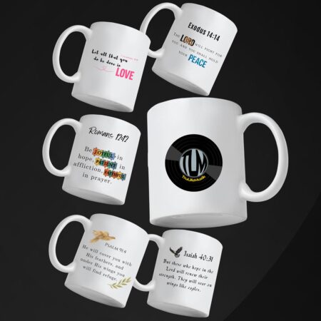 Six white ceramic mugs with Christian Bible verses and designs, arranged artistically against a dark background. Each mug features a unique scripture or logo design in various fonts and colors.